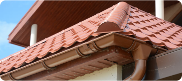tiled roof against blue sky with clouds idea background with space text ecofriendly traditional roofs home 1 - Top Tejados Ciudad Real